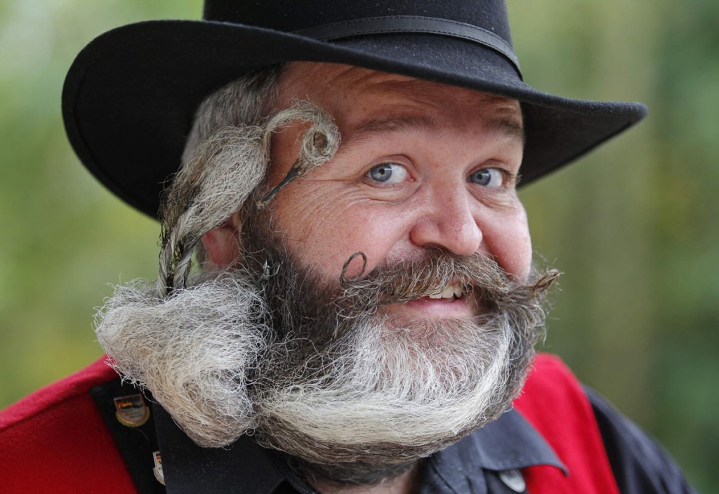 German hairdresser Weisser, poses with his beard, which is shaped as a stork, during the 2012 European Beard and Moustache Championships in Wittersdorf near Mulhouse